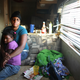 Nakeva Narcisse and daughter Asanta Mackey, 5, sit in their trailer in the FEMA Diamond trailer park May 31, 2008 in Port Sulphur, Louisiana. Asanta has a persistent cough. Doctors fear tens of thousands of children were exposed to dangerous levels of the cancer-causing agent formaldehyde in the post-Katrina FEMA trailers and could have lifelong illnesses.